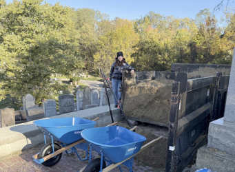 Kelly Schwimer, executive director of Jewish Cemetery & Burial Association, participates in the cleanup project at Beth Abraham Cemetery in the South Hills on Sunday, Oct. 26, 2025. The volunteer event was part of several community projects done to commemorate the seventh year since the Tree of Life Synagogue attacks on Oct. 27, 2018. (Tim Grant/Post-Gazette)