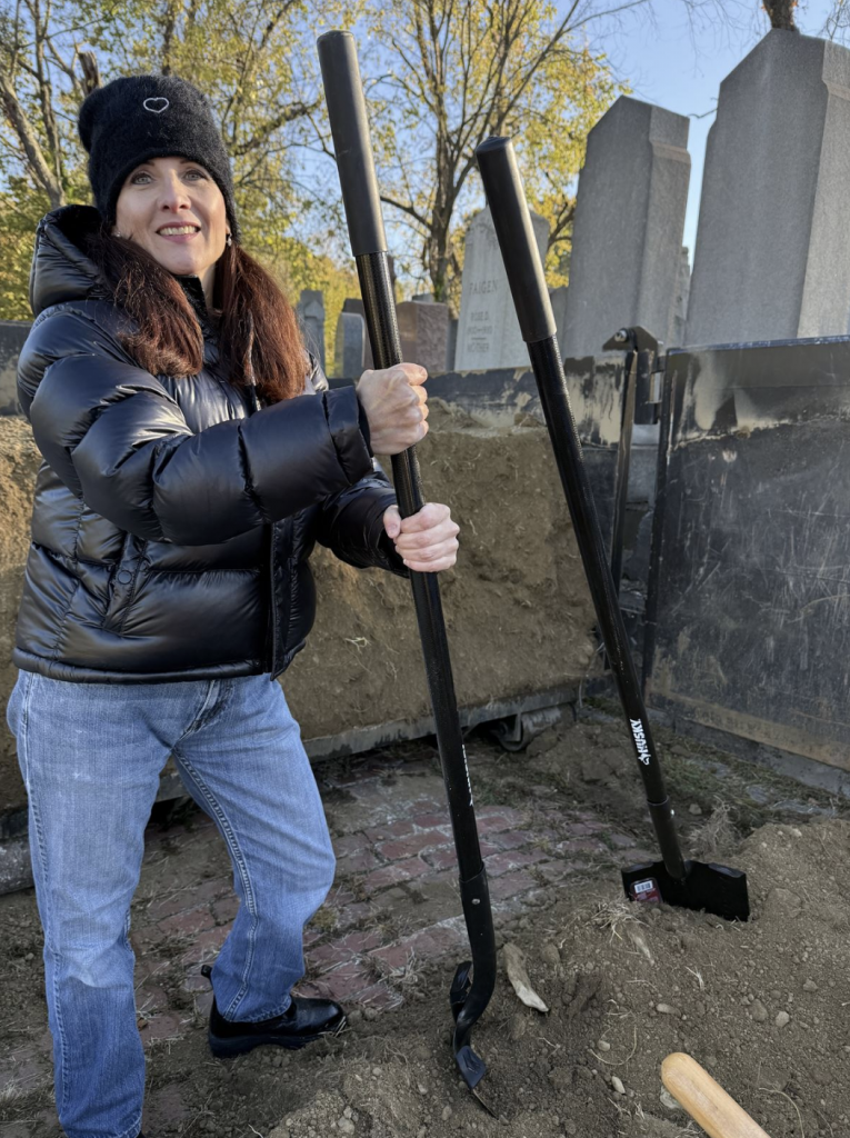 Kelly Schwimer, executive director of Jewish Cemetery & Burial Association, participates in the cleanup project at Beth Abraham Cemetery in the South Hills on Sunday, Oct. 26, 2025. The volunteer event was part of several community projects done to commemorate the seventh year since the Tree of Life Synagogue attacks on Oct. 27, 2018. (Tim Grant/Post-Gazette)
